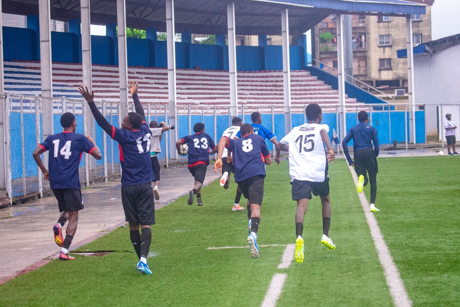 Dreamland Football Academy players celebrating a goal