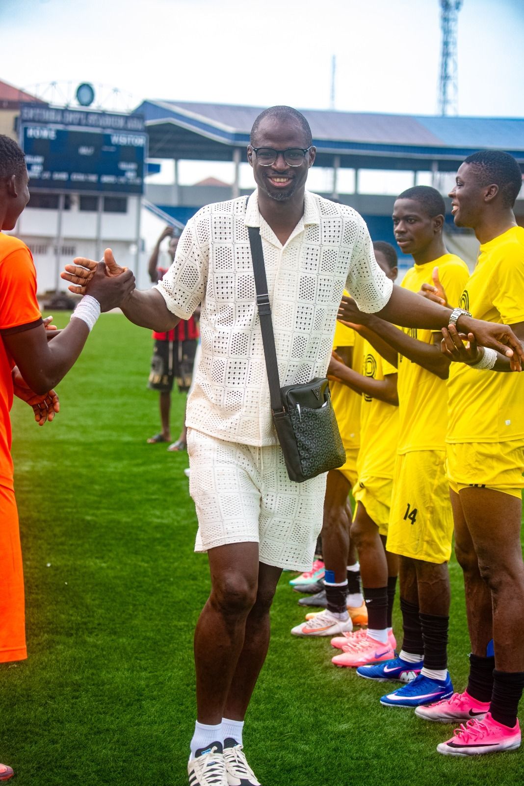 Officials greet the teams before kick-off