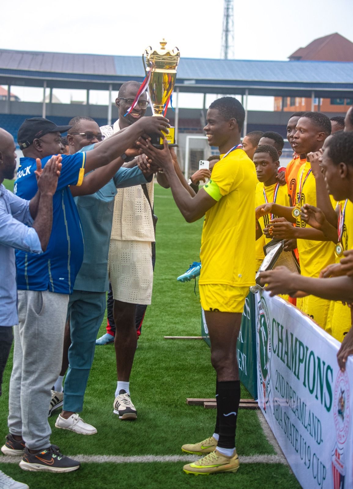 The winners' trophy is handed over