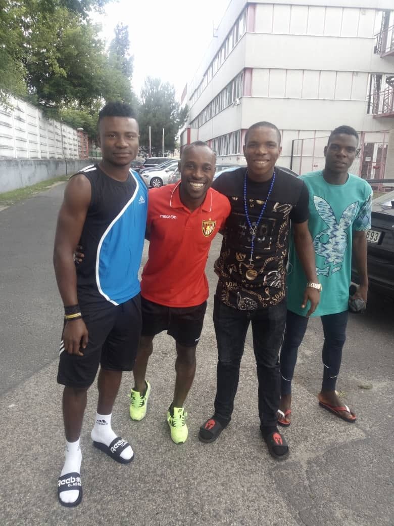 Academy staff and players outside the facility