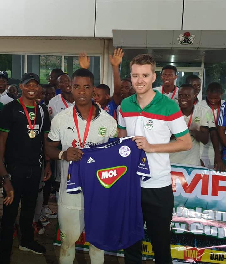 A MOL Vidi FC shirt presented to a Dreamland player
